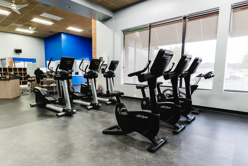 Bikes and ellipticals in the cardio area at Foundation Fitness Cambridge